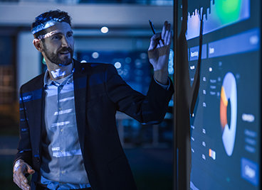 Man with a chart to symbolise purpose, one of IP Group's values